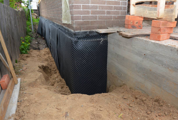 SJ Waterproofing Pros technician performing targeted Waterproofing assessment in Secaucus, NJ